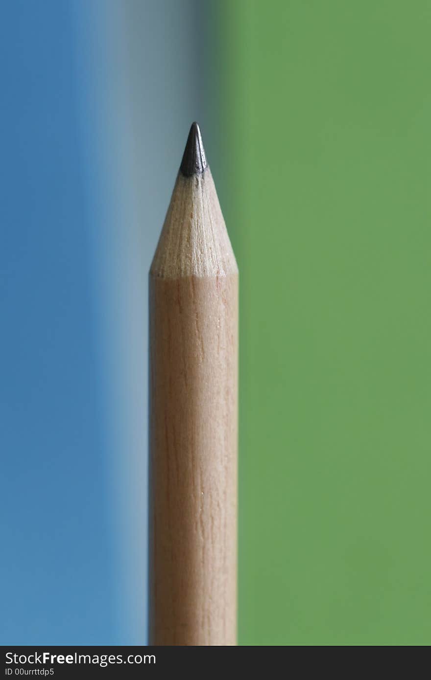 A pencil with a simple color background