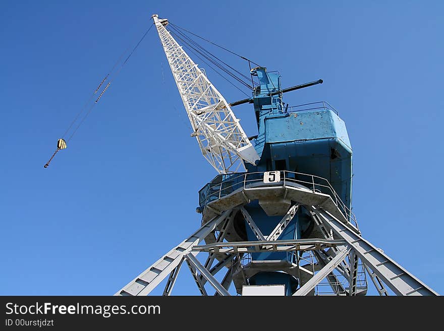 Crane On Blue Background.