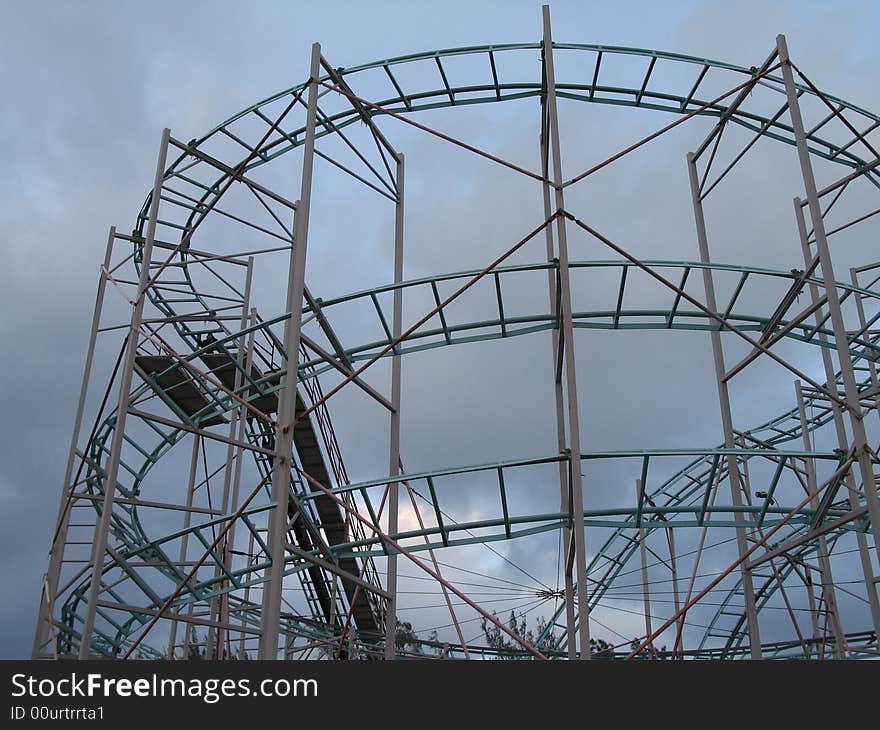 Roller coaster with dark grey background sky