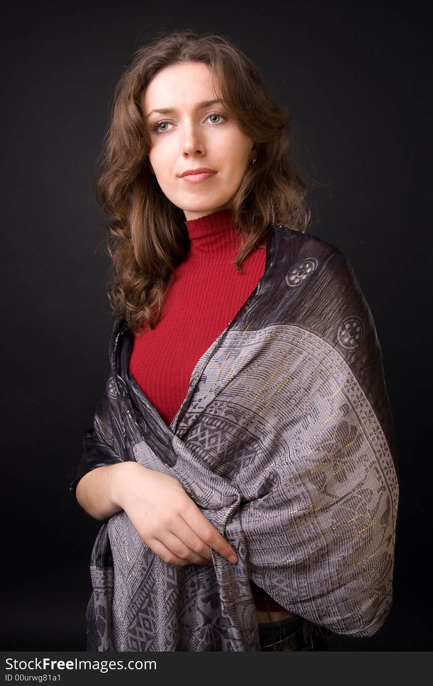 The beautiful girl in studio on a black background.