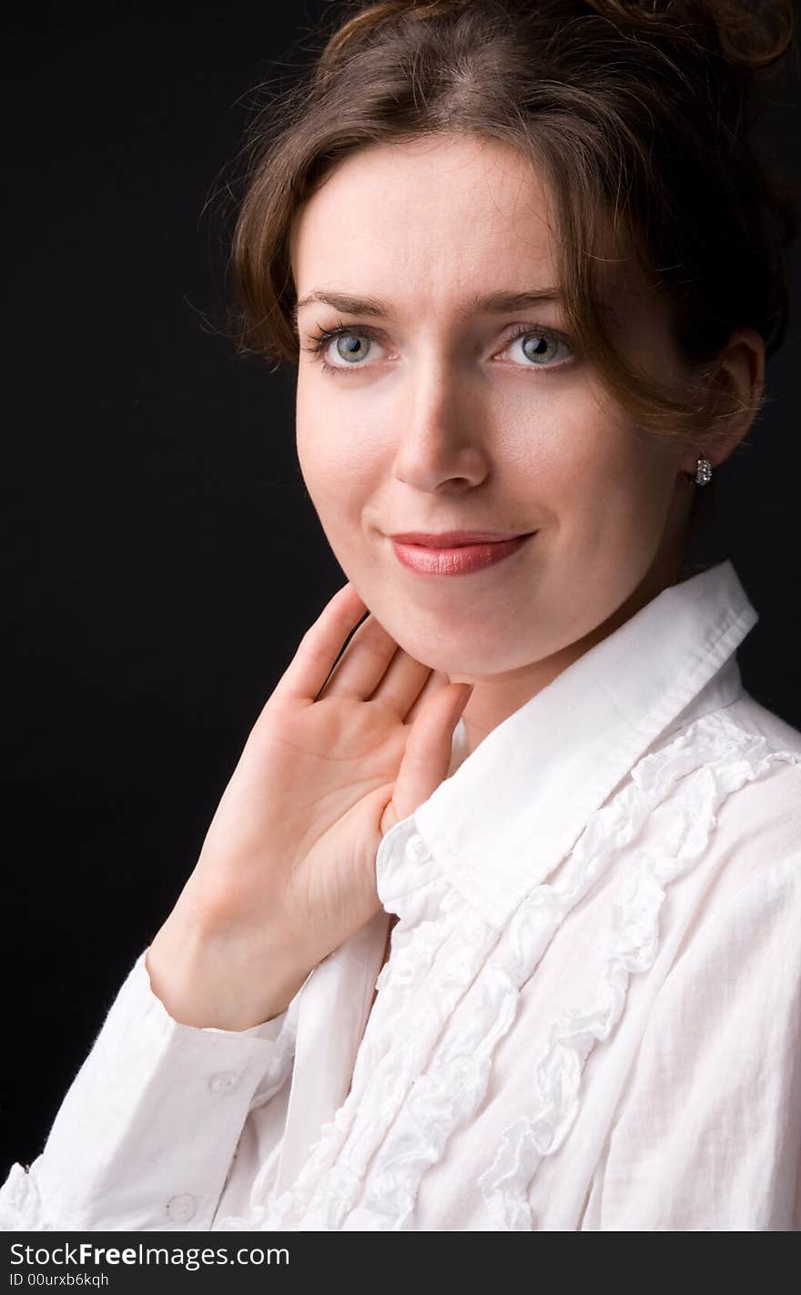 The beautiful girl in studio on a black background.