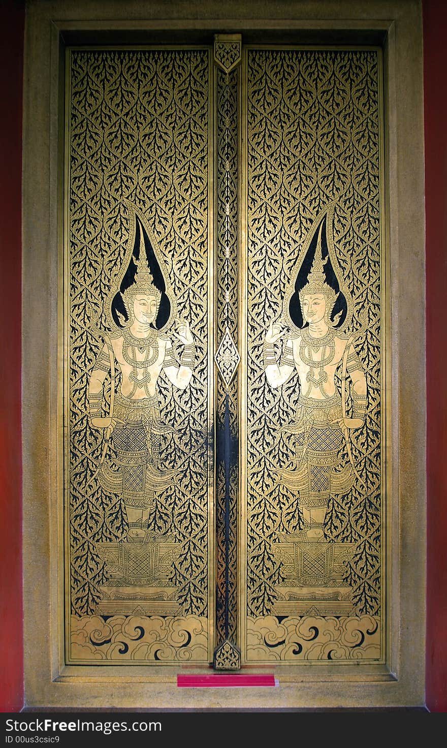 Thailand, Bangkok: door of the golden buddha temple; carved wood decorated with golden leaf. Thailand, Bangkok: door of the golden buddha temple; carved wood decorated with golden leaf