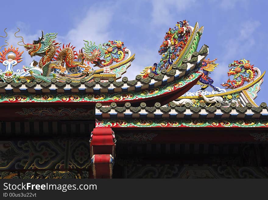 Thailand, Bangkok: Chinatown, temple; detail of the temple's roof with the typical fantastic dragon