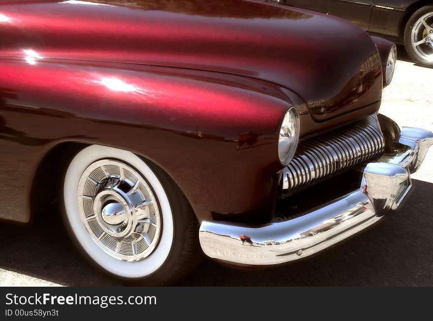 A classic red  custom 50s America car. A classic red  custom 50s America car