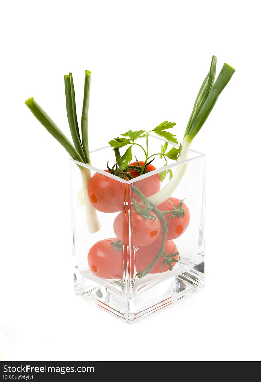 Tomatoes in a glass vase, healthy diet. Tomatoes in a glass vase, healthy diet