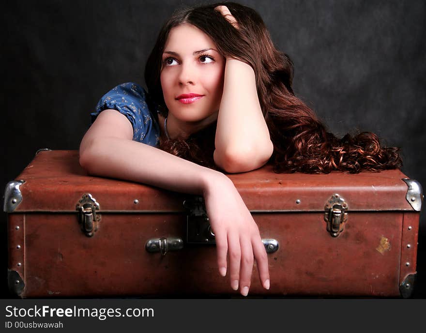 Beautiful girl on a suitcase. Beautiful girl on a suitcase