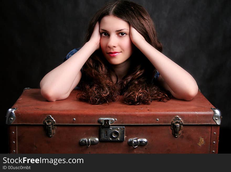 Beautiful girl on a suitcase. Beautiful girl on a suitcase