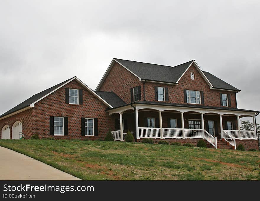 Large Brick home With two garages.