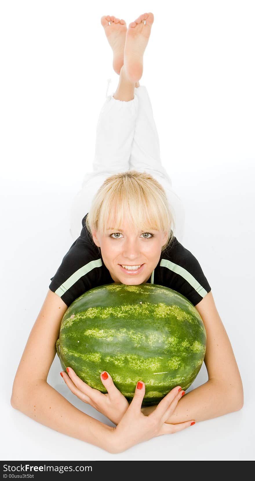 Beautiful young fruit-grower love to embrace water-melon