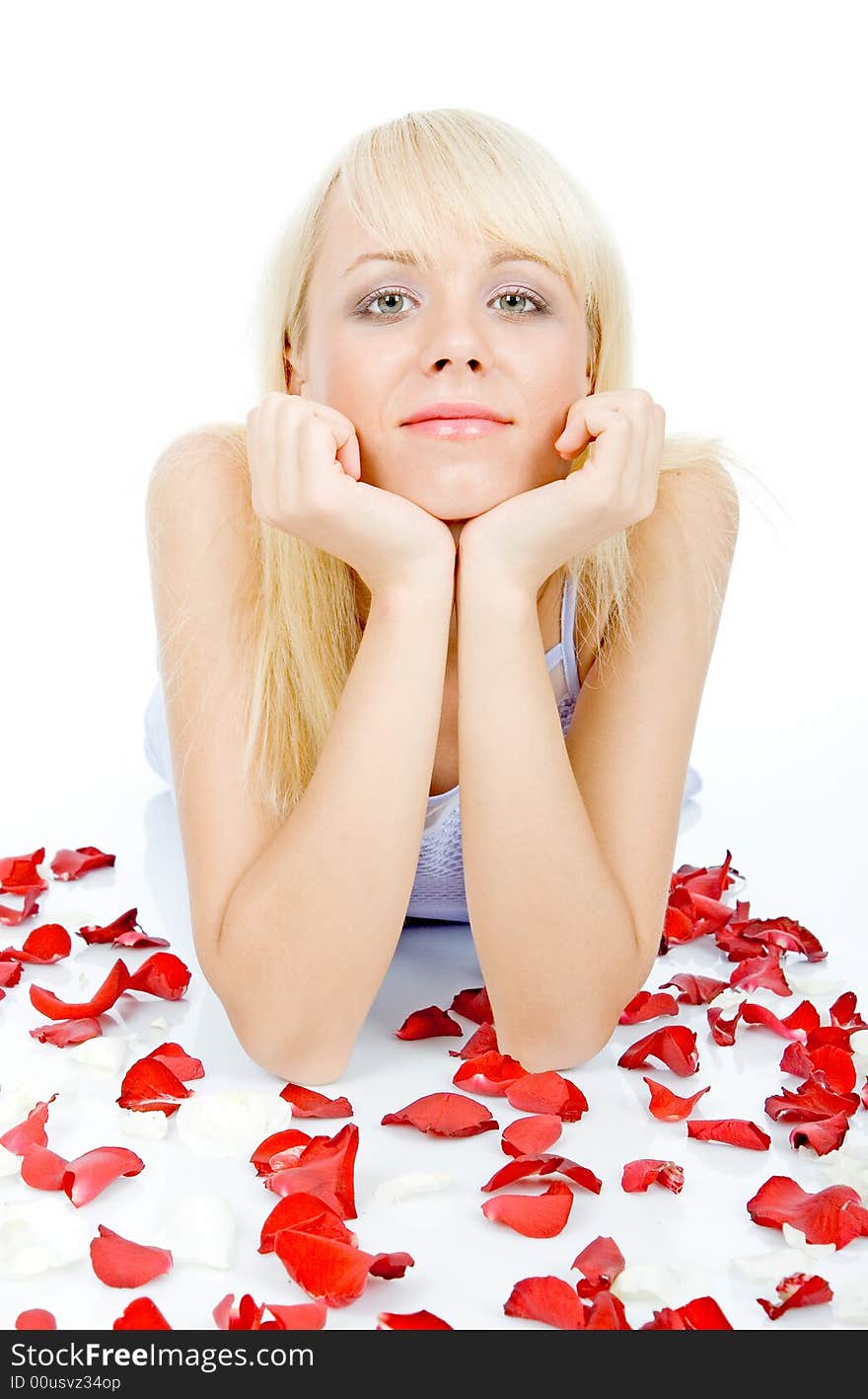 Posing on red rose petal field