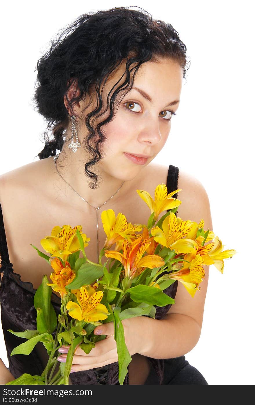 The beautiful girl holds flowers