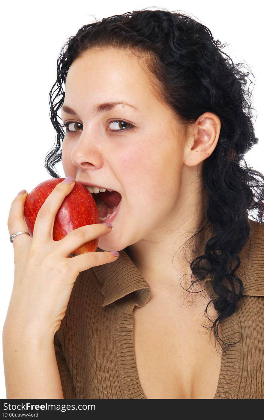 The beautiful girl bites a apple