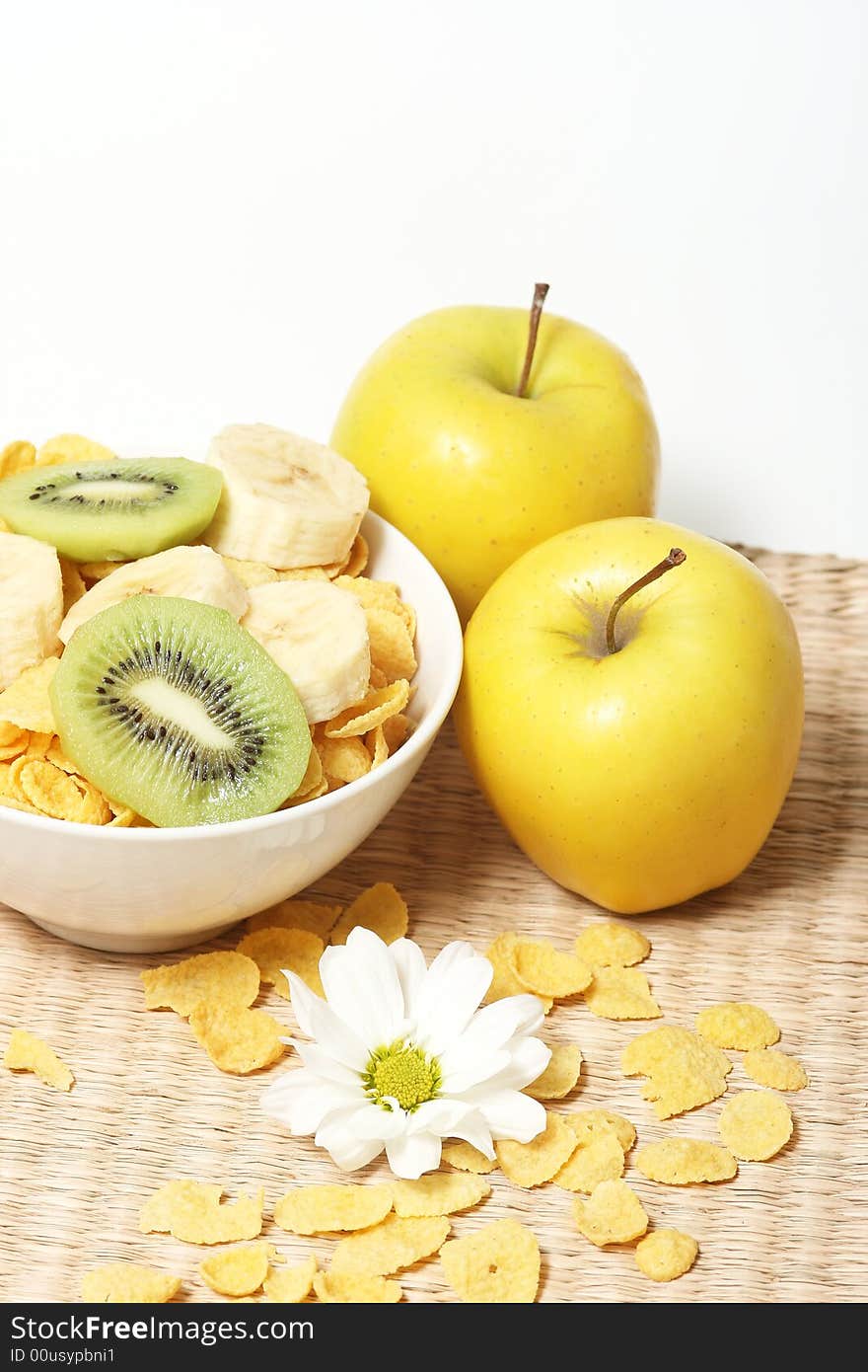 Healthy breakfast.Cornflakes and fruits with flower.