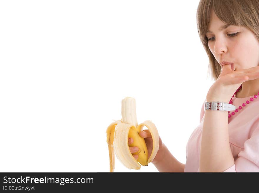 The young attractive girl with a banana isolated on a white background