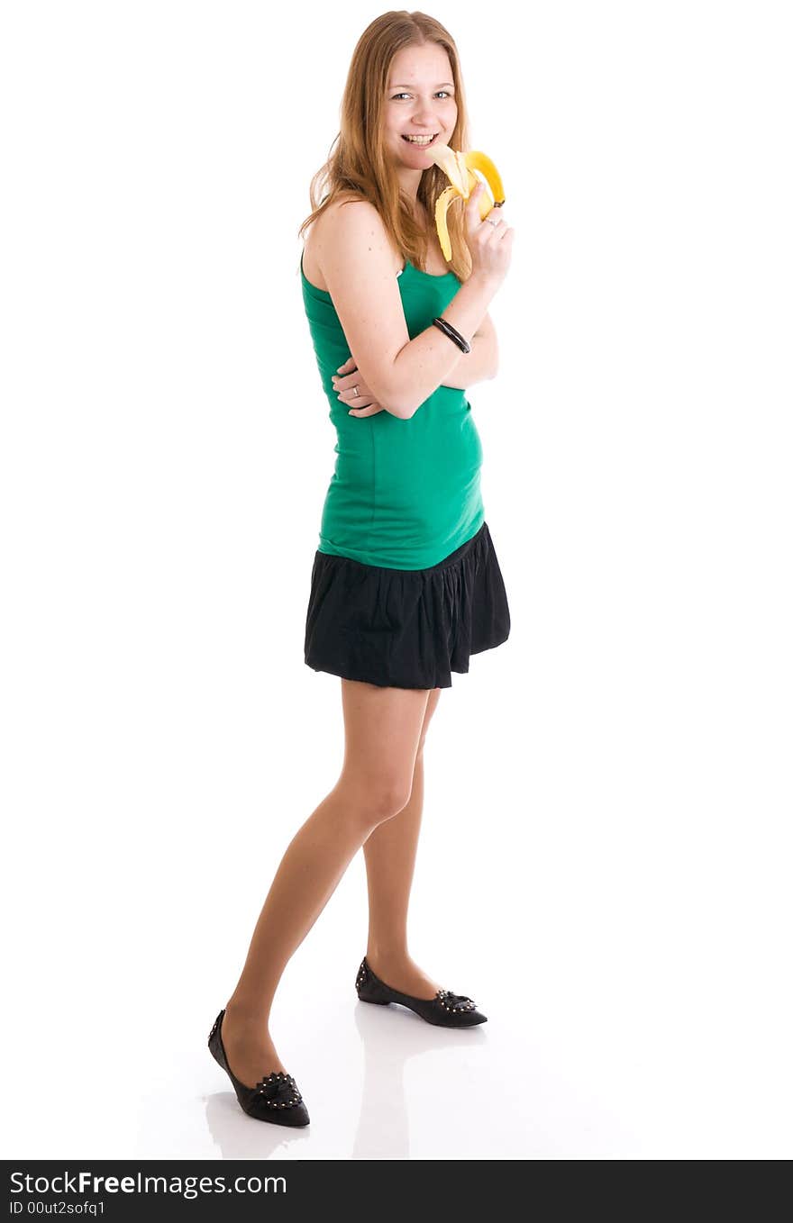 The young attractive girl with a banana isolated on a white background