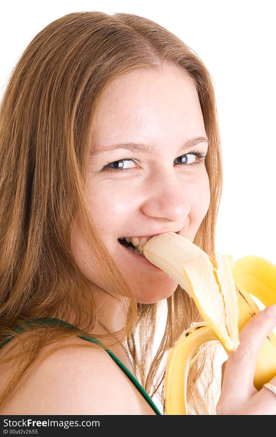 The young attractive girl with a banana isolated on a white background