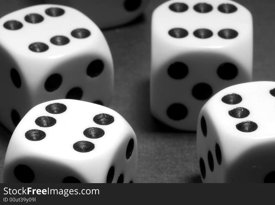 White dices on black background