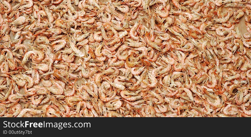 It is making dried shrimps food. It is making dried shrimps food.