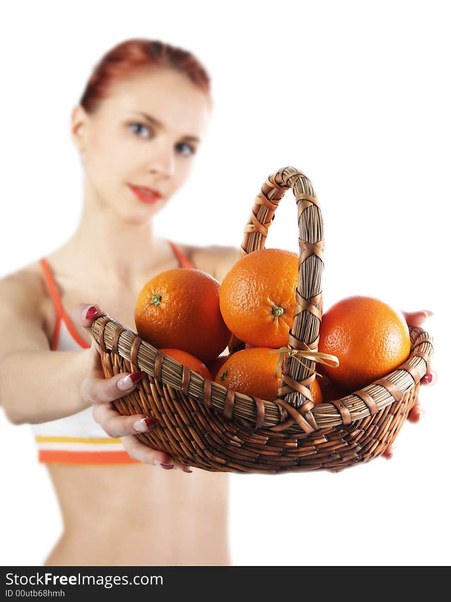 Redhead girl with basket of fresh oranges. Redhead girl with basket of fresh oranges