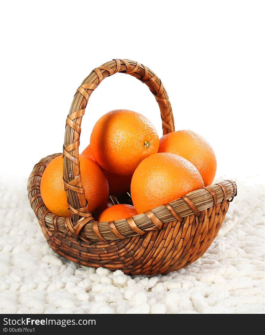 Basket with oranges isolated on white background. Basket with oranges isolated on white background