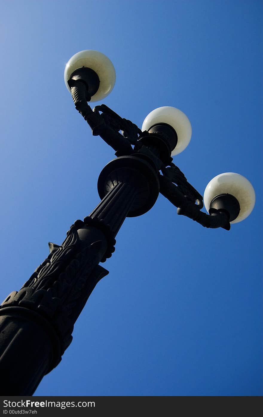 Street lamp against the backdrop of a blue sky