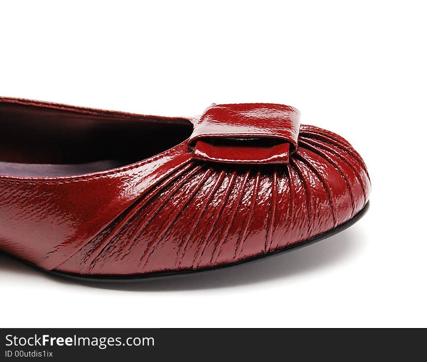 Red womanish shoes on a white background