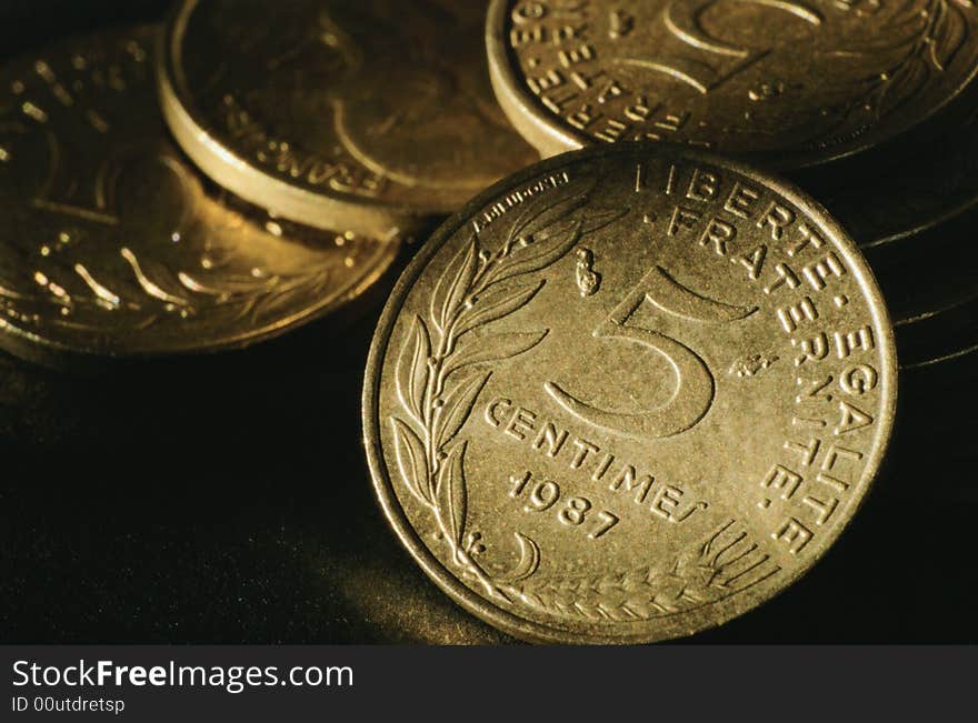 Placer coins close-up face value on five unit of value