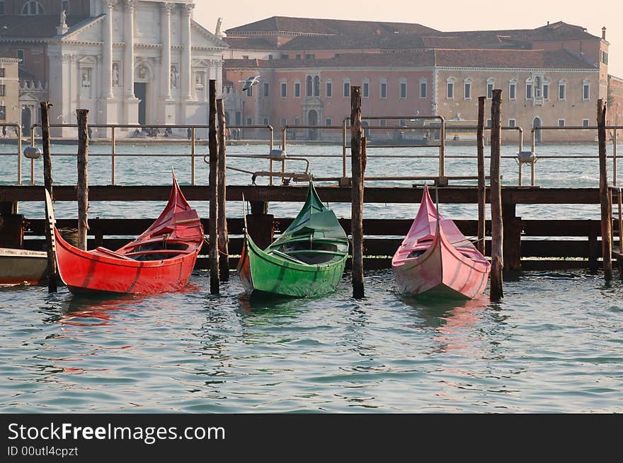 Gondola coloured of three colors, red, green and pink in venice. Gondola coloured of three colors, red, green and pink in venice