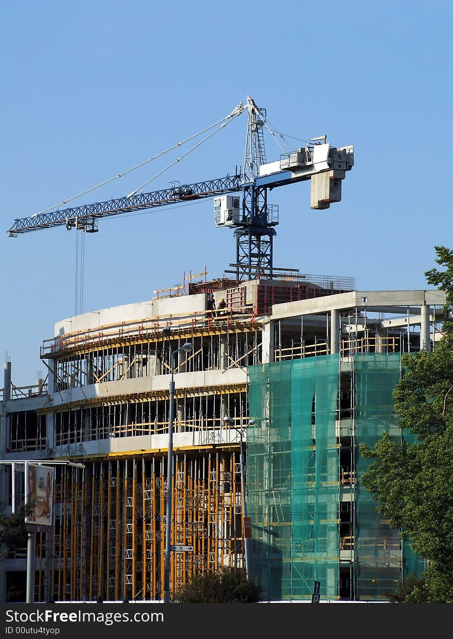 A under construction house on a background of the blue sky. A under construction house on a background of the blue sky