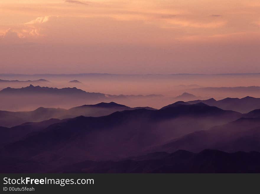 Mountains and clouds in early morining light