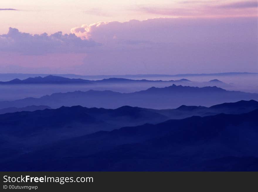 Mountains and clouds in early morning light