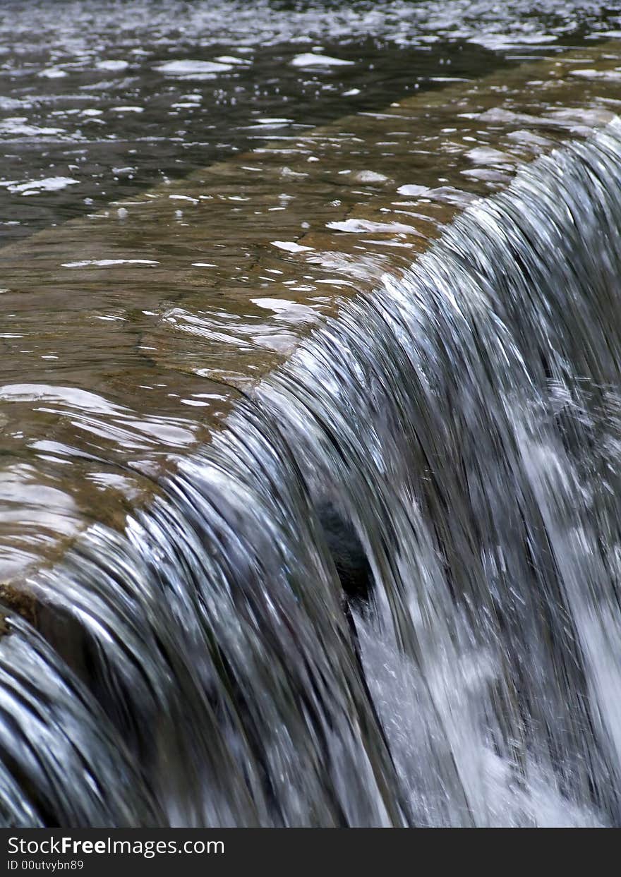 Water flows along a mountain stream