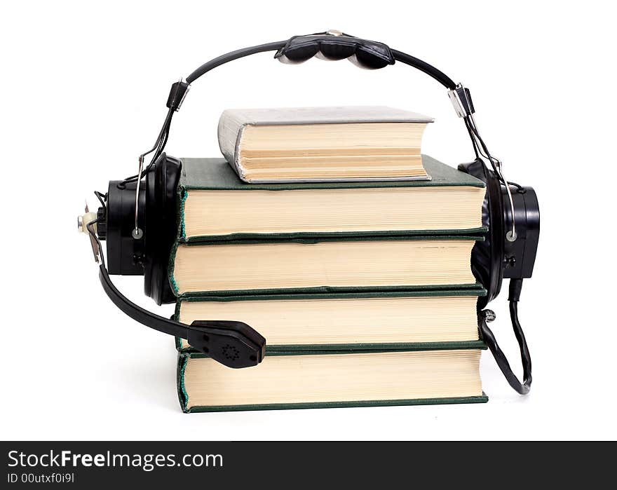 Audiobook conception with headphones and books