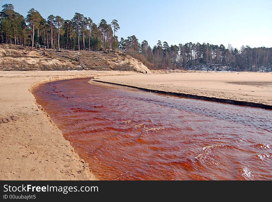 The Peterupe river on sandy plain.