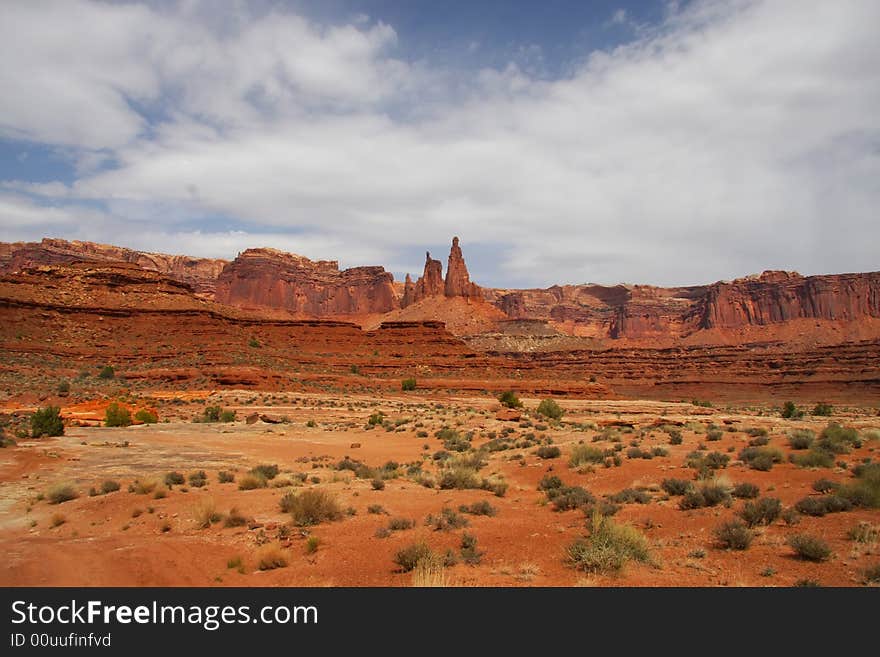 View of the red rock formations in Canyonlands National Park with blue sky�s and clouds. View of the red rock formations in Canyonlands National Park with blue sky�s and clouds