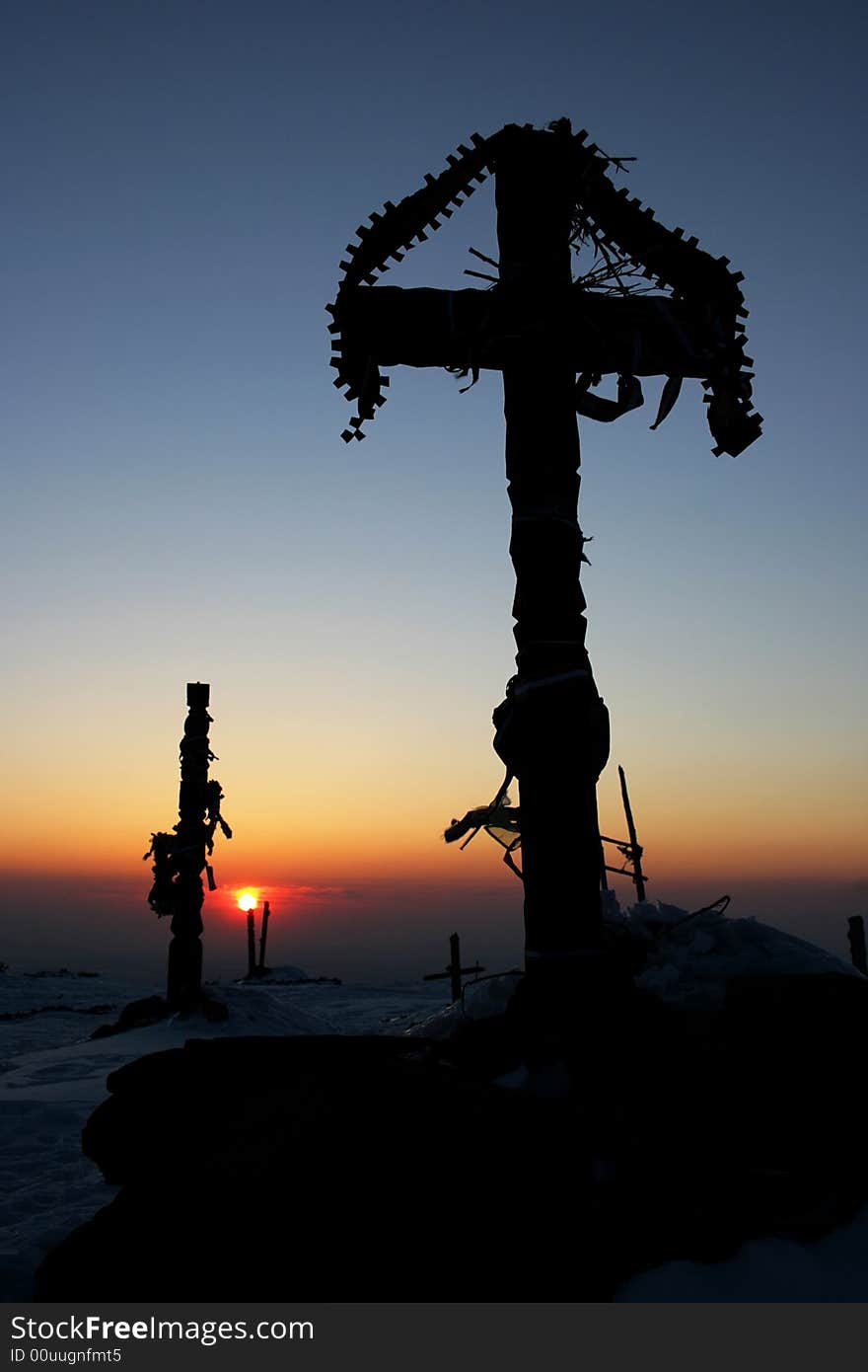 Cross silhouette at the sunset