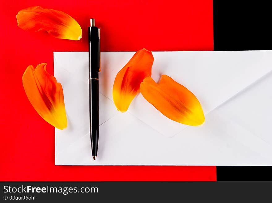 Pen And Petals On A White Envelope