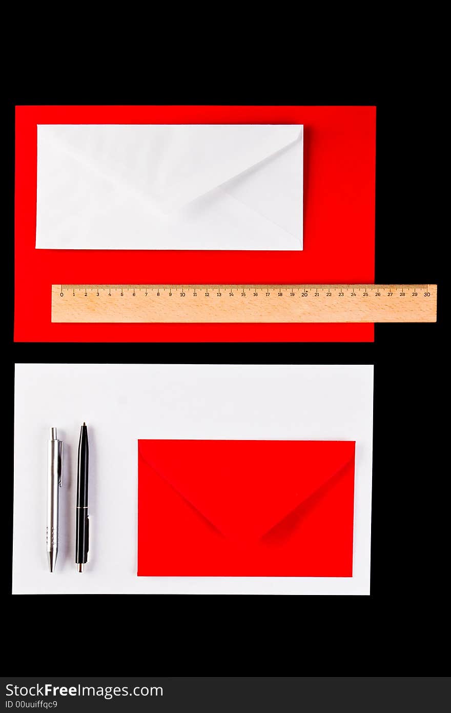 Envelopes, pens and a ruler on a black background. Envelopes, pens and a ruler on a black background