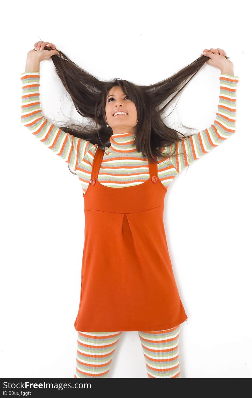 Young brunette girl in orange dress.