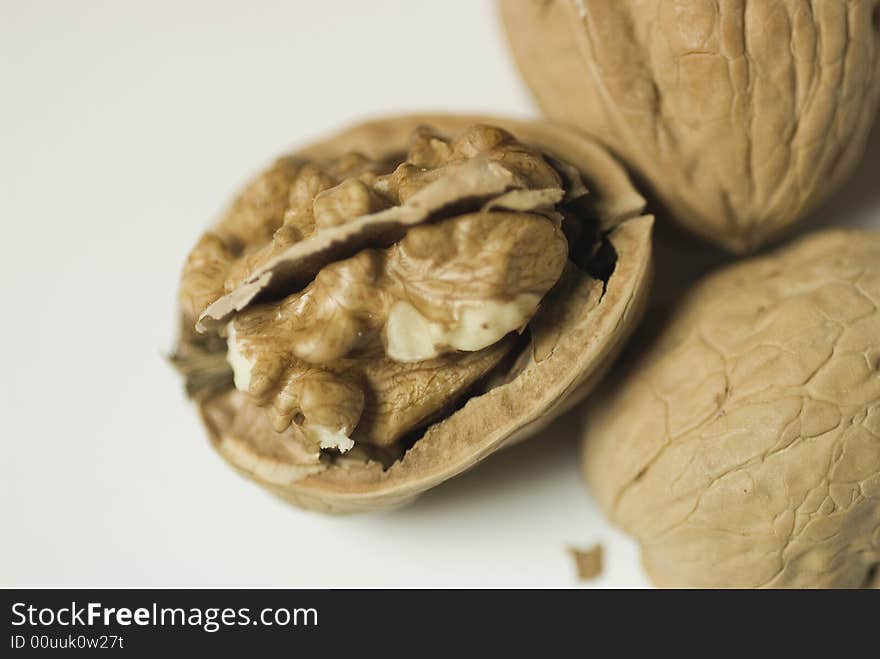 Walnuts, kernel and walnuts shell on a grey surface