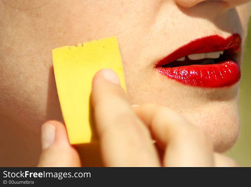 An image of a woman face making up. An image of a woman face making up