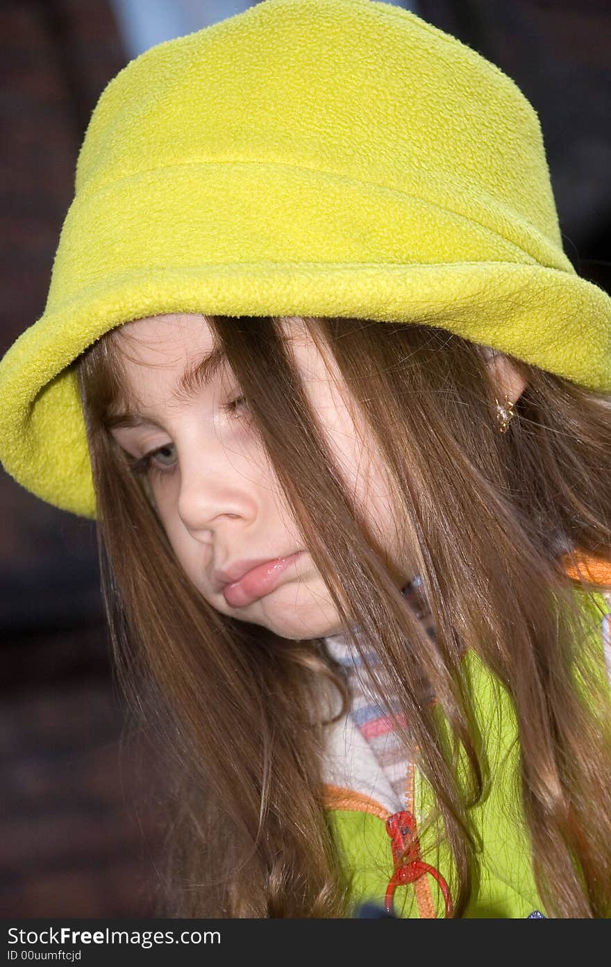 Little beautiful girl pouting her lips uoutdoors. Little beautiful girl pouting her lips uoutdoors