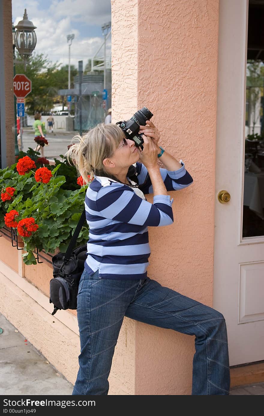 Active senior lady taking picture. Active senior lady taking picture