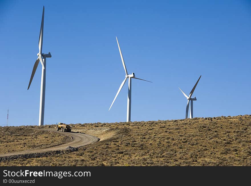 Wind turbines and dump truck.