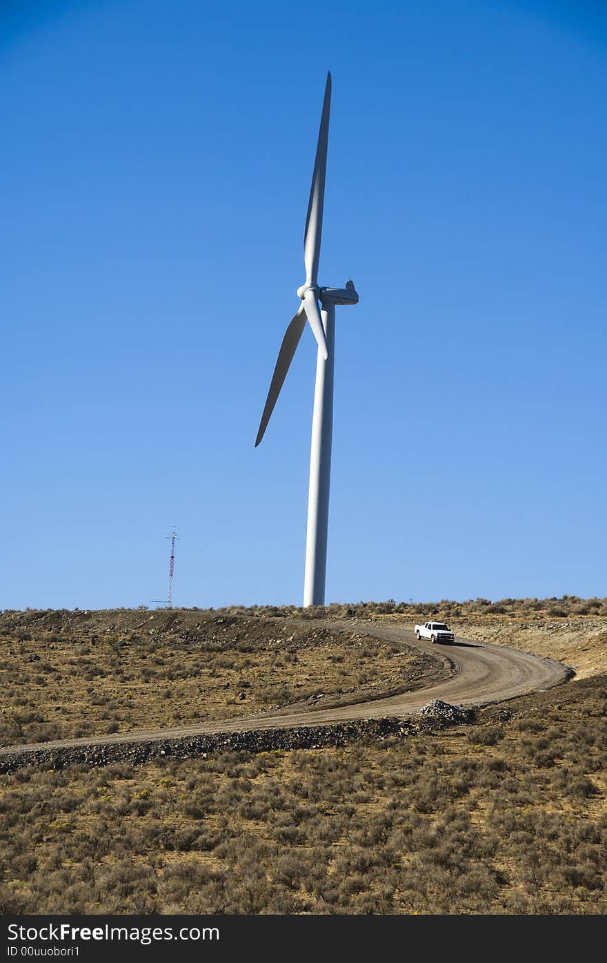 Wind turbines and pickup truck.