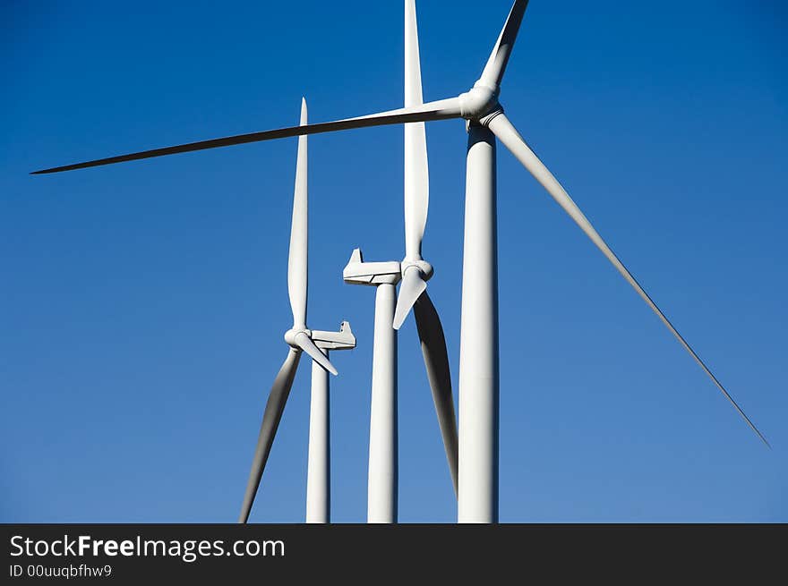 Wind turbines, blue sky.