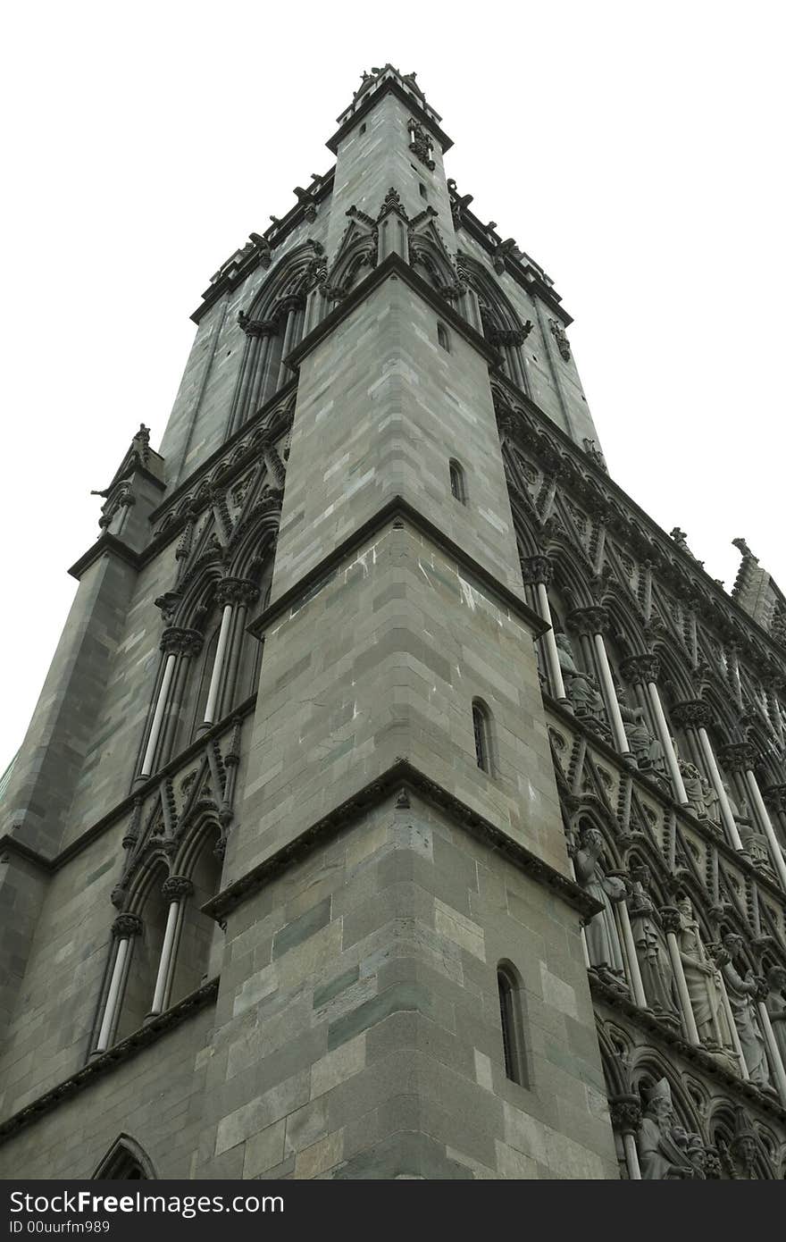 A tower of church in Trondheim city, ancient historical building, Norway