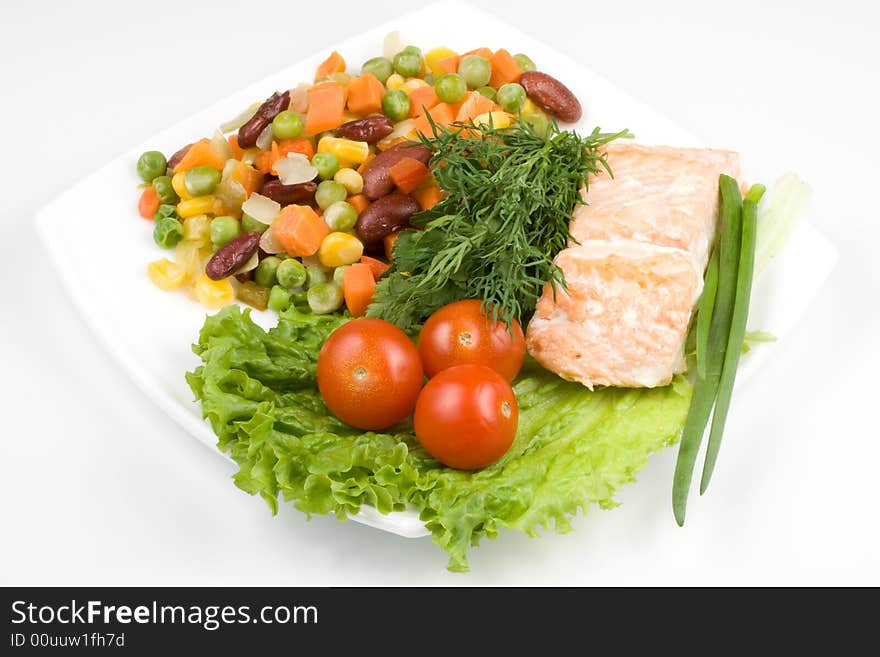 Stake from a salmon with vegetables on a plate