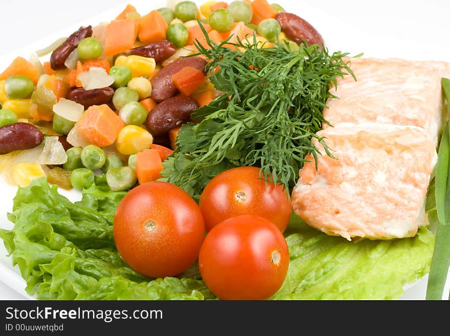 Stake from a salmon with vegetables on a plate