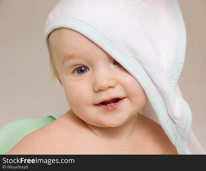 Smiling baby with towel on his head after bath. Smiling baby with towel on his head after bath